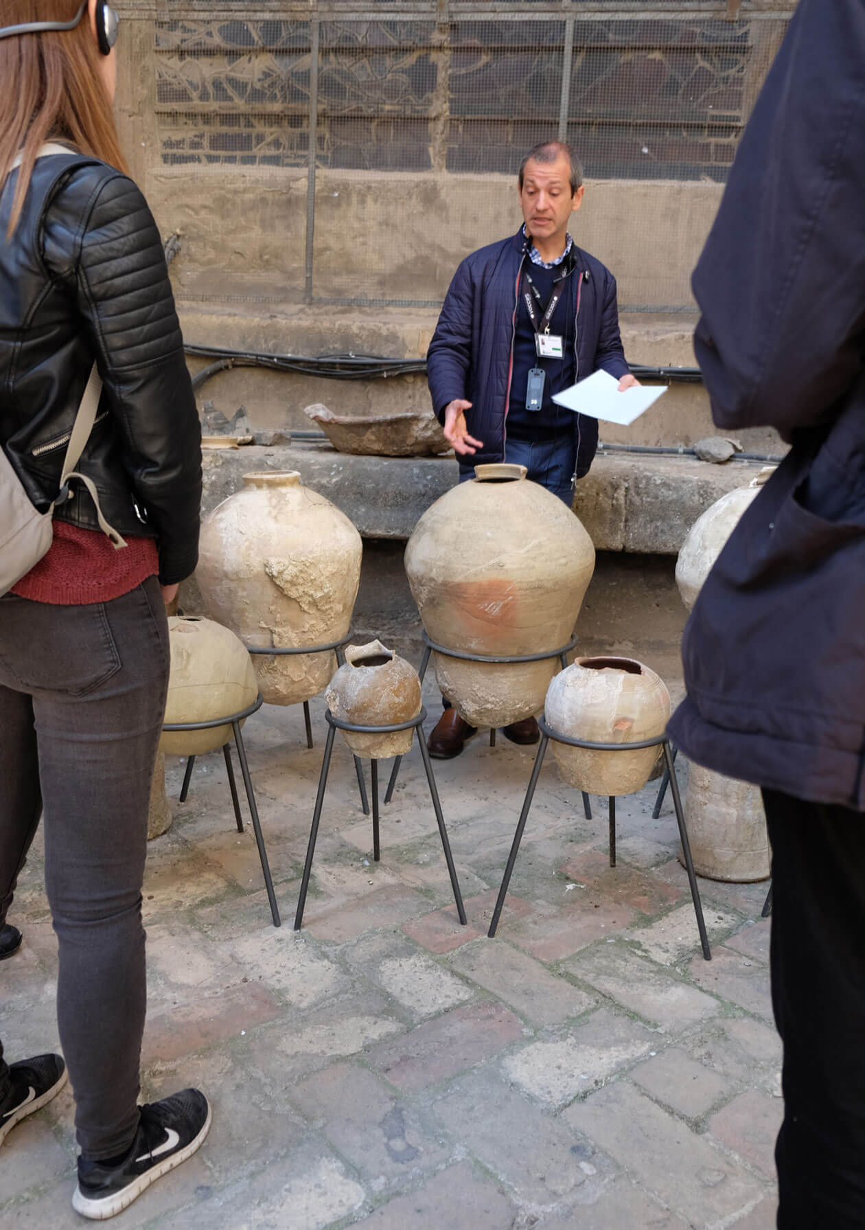 Our guide showing us examples of the terracotta pots which were used to fill the roof cavities