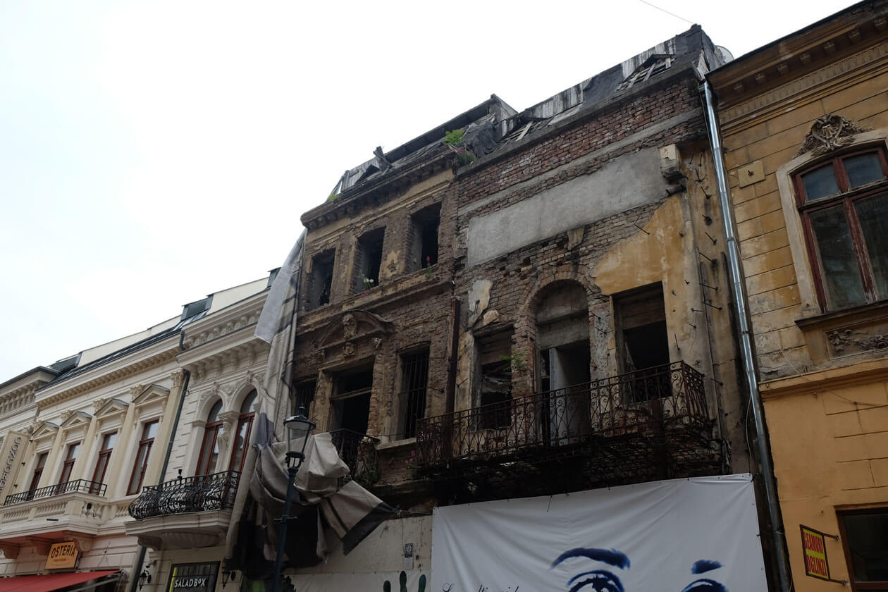 In Bucharest's historic centre, derelict buildings are next door to newly restored ones