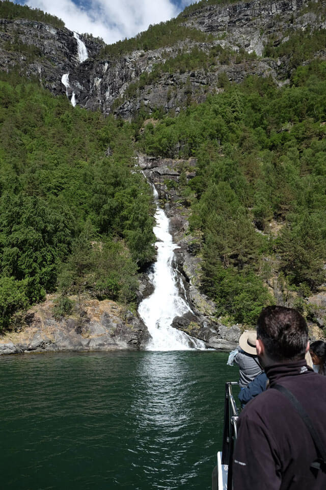 The boat slowed and got up close to this waterfall in the Nærøyfjord
