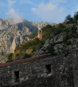 Kotor city walls and church in the evening sunshine
