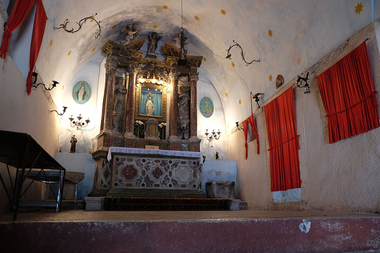 Inside the tiny church, halfway up the mountain
