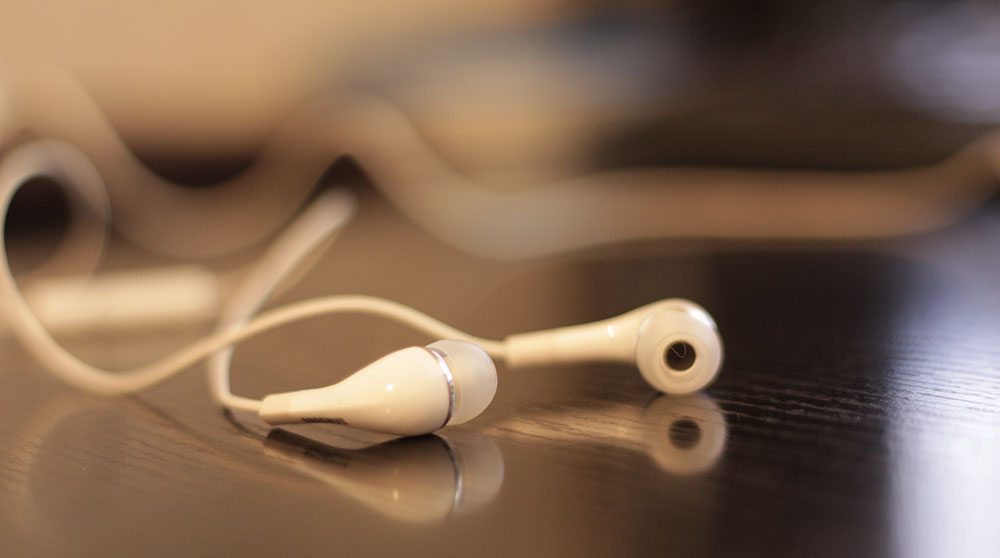 Earphones for listening to travel podcasts