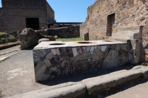 A shop counter in Pompeii. Our tour guide explained to us how people in Pompeii often bought their food from these ancient takeaways