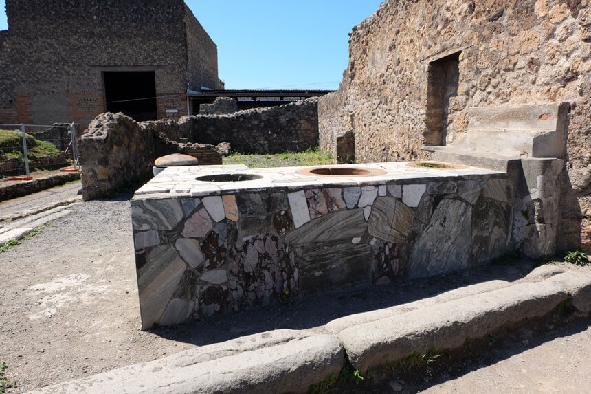 A shop counter in Pompeii. Our tour guide explained to us how people in Pompeii often bought their food from these ancient takeaways.