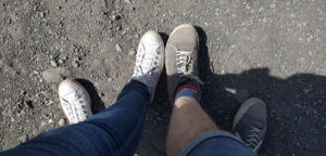 Our shoes covered in red dust after climbing up to the crater on Mount Vesuvius