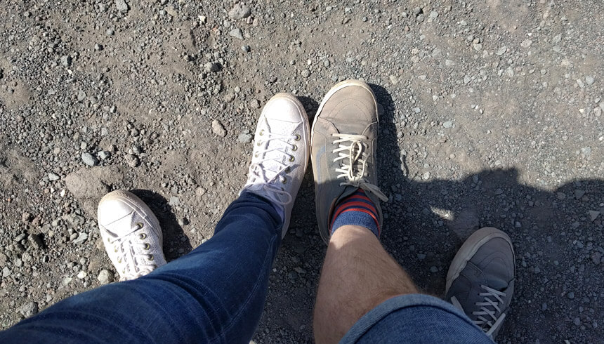Our shoes covered in red dust after climbing up to the crater on Mount Vesuvius