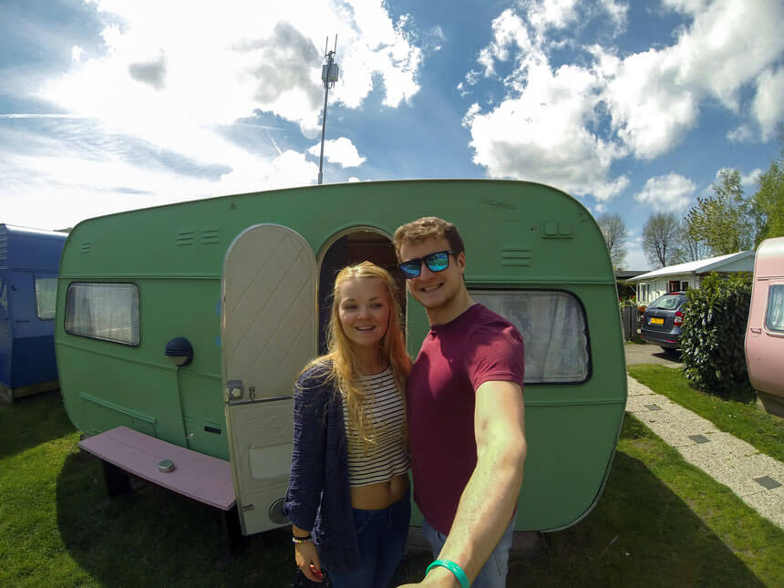 Gemma and her other half outside their caravan in Amsterdam on her 21st birthday