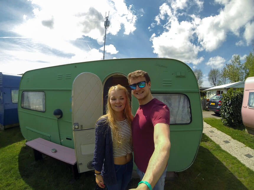 Gemma and her other half outside their caravan in Amsterdam on her 21st birthday