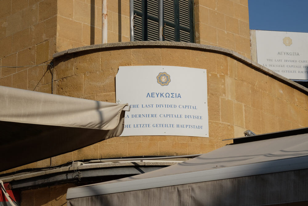 A sign on the Greek side describing Nicosia as the world's last divided capital city