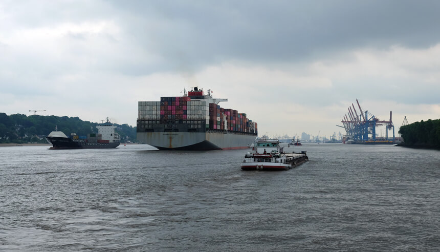 Following a giant container ship down the Elbe on Hamburg's number 62 ferry
