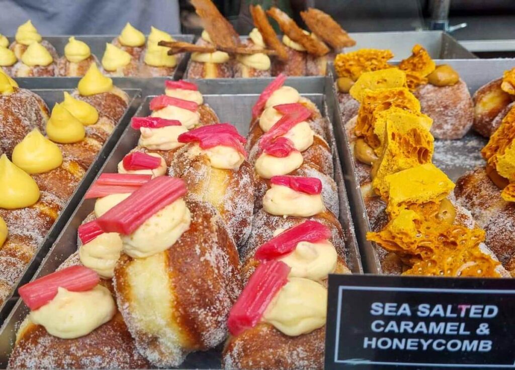 A range of decorated donuts on a donut tour of London