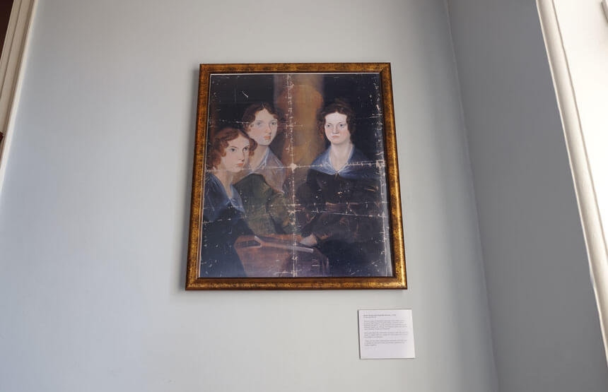 Branwell Brontë's famous portrait of his sisters (left to right) Anne, Emily and Charlotte. You can clearly see where he painted his own face out of the picture.