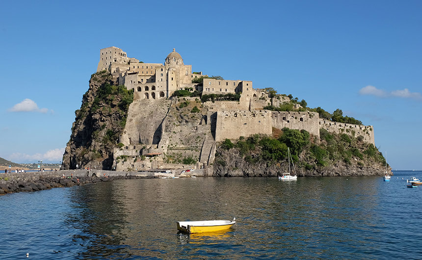 Castello Aragonese sits at the end of a long causeway in the village of Ischia Ponte