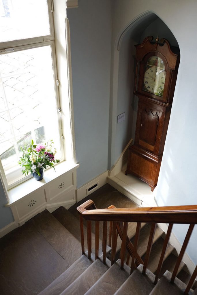 The grandfather clock on the stairs