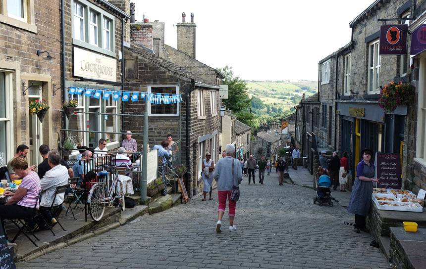 The Main Street in Haworth, where the Brontë sisters spent most of their lives. Haworth is a former mill town in West Yorkshire, England.