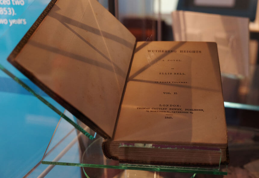 A first edition of Emily Brontë's novel Wuthering Heights on display at the Brontë Parsonage Museum in Haworth. Like Charlotte, Emily originally published under a male pseudonym.