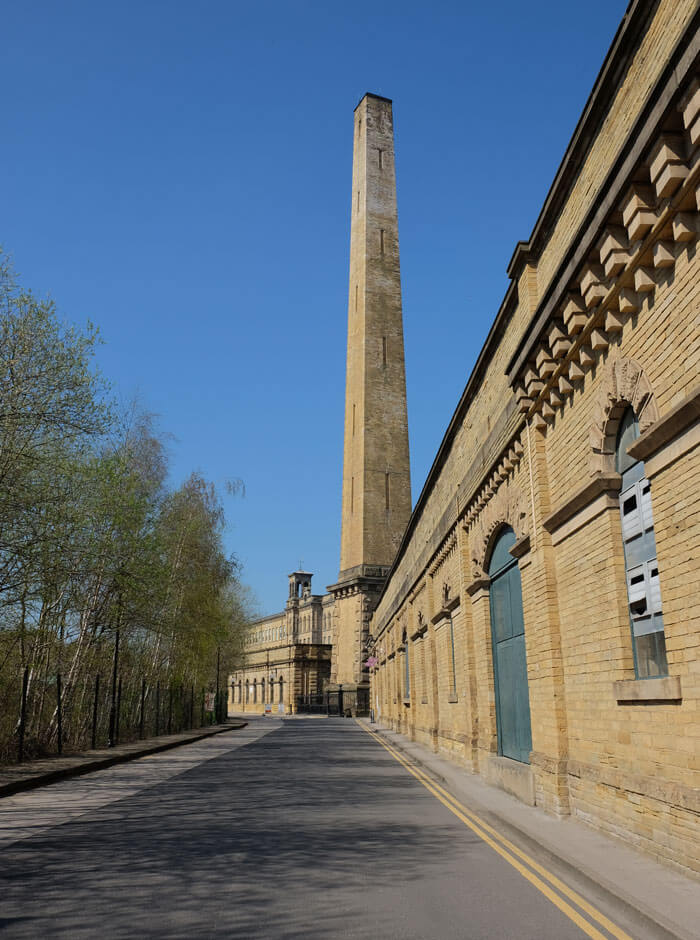 Walking towards the Salts Mill visitor entrance from the car park. There's a fascinating early music shop in the buildings on the right.