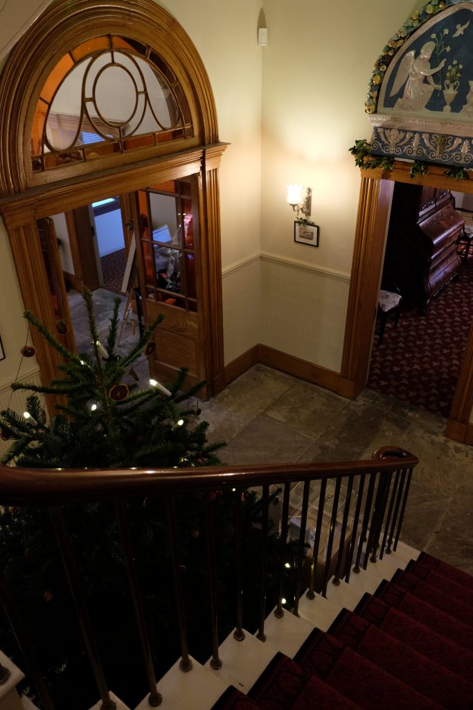 The lovely stairs at William and Elizabeth Gaskell's home in Manchester, decorated for Christmas