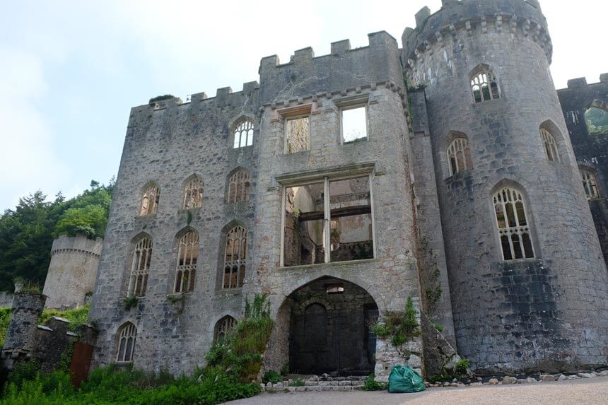 The main house at Gwrych Castle is in a sad state, open to the elements with no roof. The four-storey castle with a tower has several arched windows, all of which are missing their glass. It feels pretty spooky even in the sunshine.