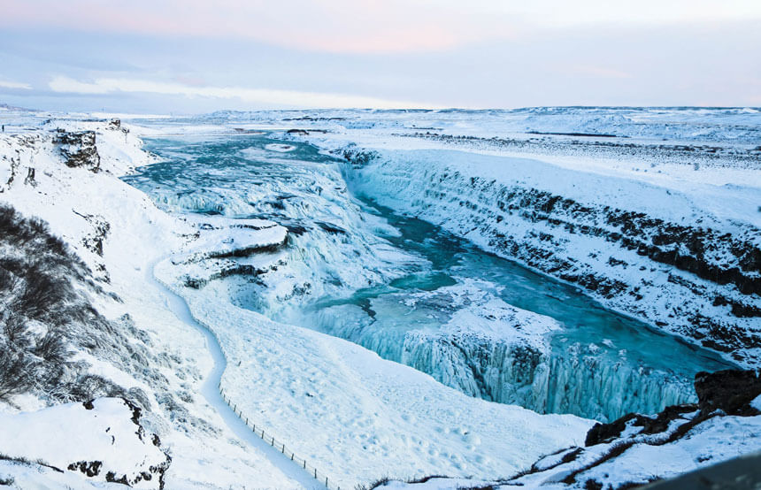 A frozen Gullfoss waterfall during winter in Iceland. Photo by Michele Orallo on Unsplash