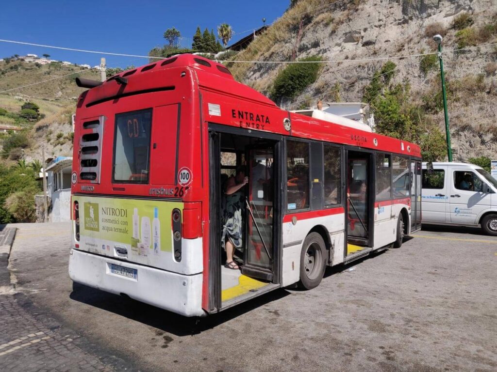 A red bus with a door open