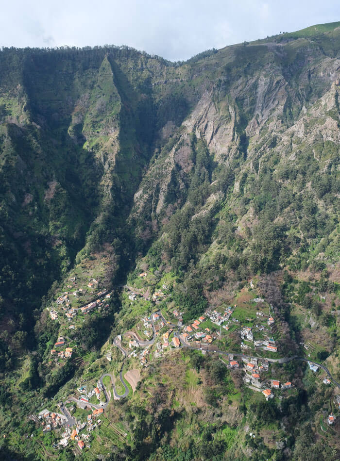 The view into the valley from the Eira do Serrado viewpoint. The road in the valley is typical of the ones I saw in Madeira - a bit twisty but well maintained. Spot the bus!