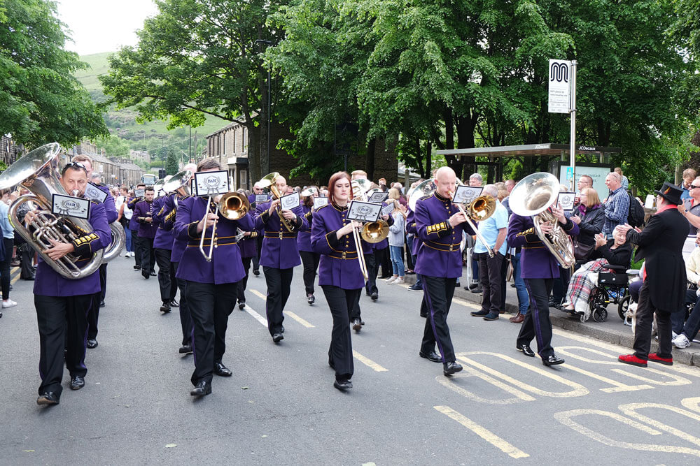 The mighty Brighouse and Rastrick brass band marching at Greenfield Whit Friday band contest