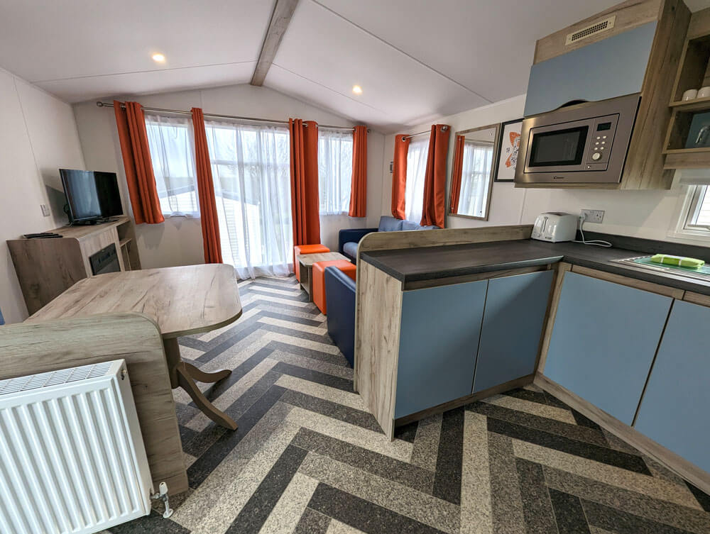 The kitchen and living area in our New Wave Gold caravan at Woolacombe Bay Holiday Park