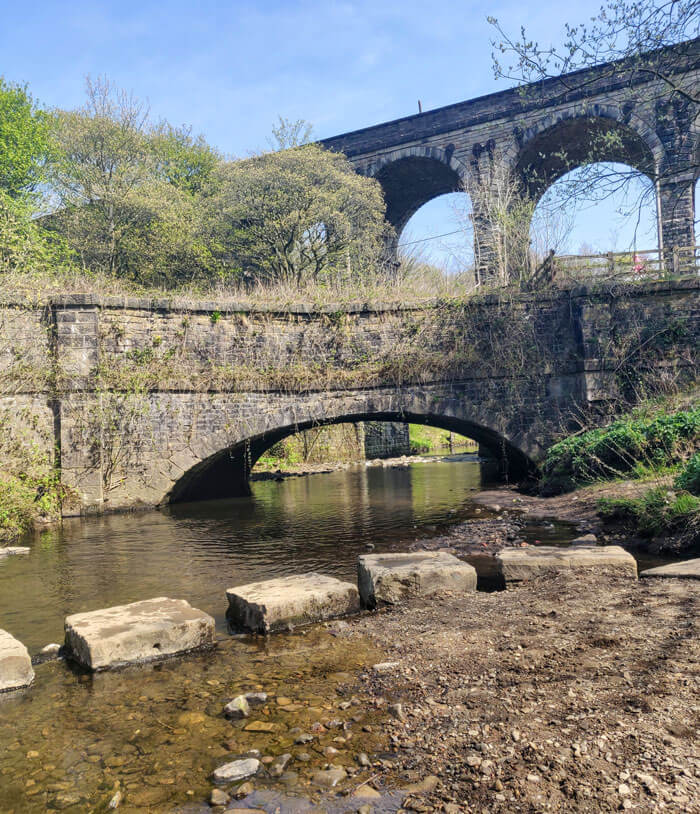 The stepping stones underneath the viaduct and canal aqueduct