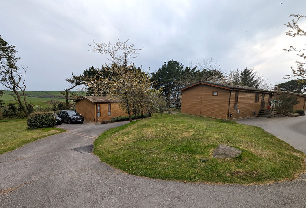 Two lodges in the premium Surf Village area. This part of the site feels very spacious and has lovely views over the surrounding hills.