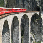 Compare the Bernina Express vs regional trains on the Albula and Bernina rail line. Get useful tips to make the most of your trip between Switzerland and Italy.