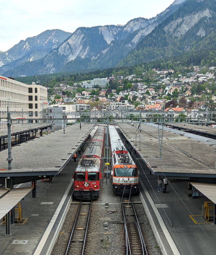Two Rhaetian Railway trains ready to depart at Chur station