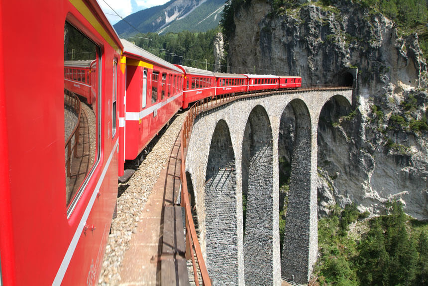 A red train on the Albula Line's Landwasser Viaduct