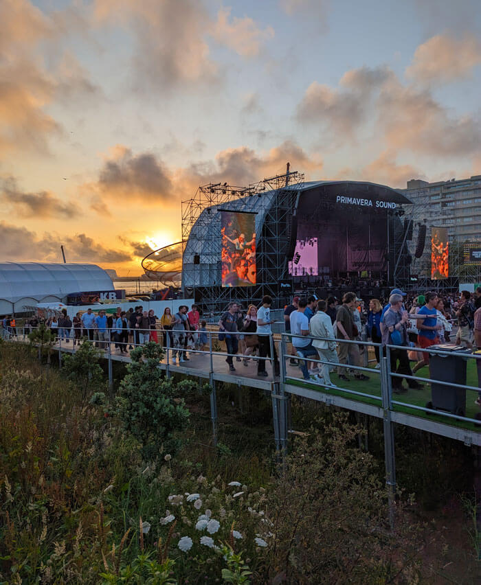 The sun setting into the Atlantic behind the main Porto stage