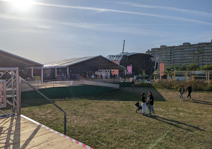 The VIP area at Primavera Sound Porto. The two buildings with pointed roofs are the VIP bar. I'm sat in the Vodafone chill out area.