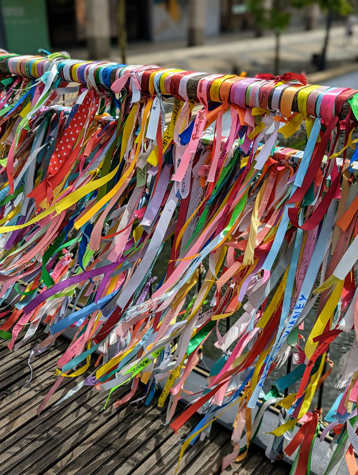 Aveiro's version of love locks is brightly coloured ribbons with the couple's names written on them.