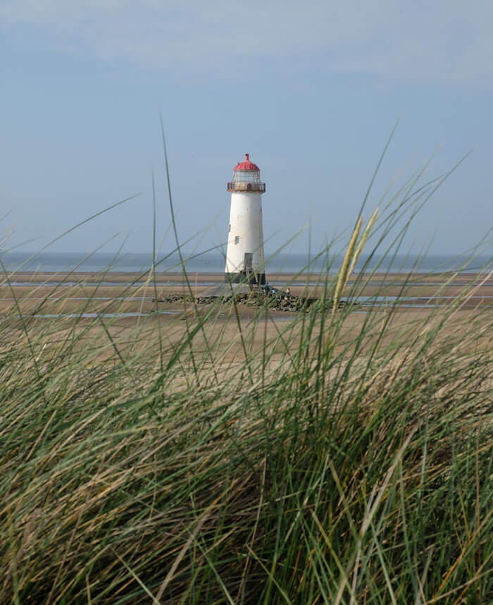 The beach and lighthouse at Talacre, on the North Wales coast but an easy seaside day trip from Manchester