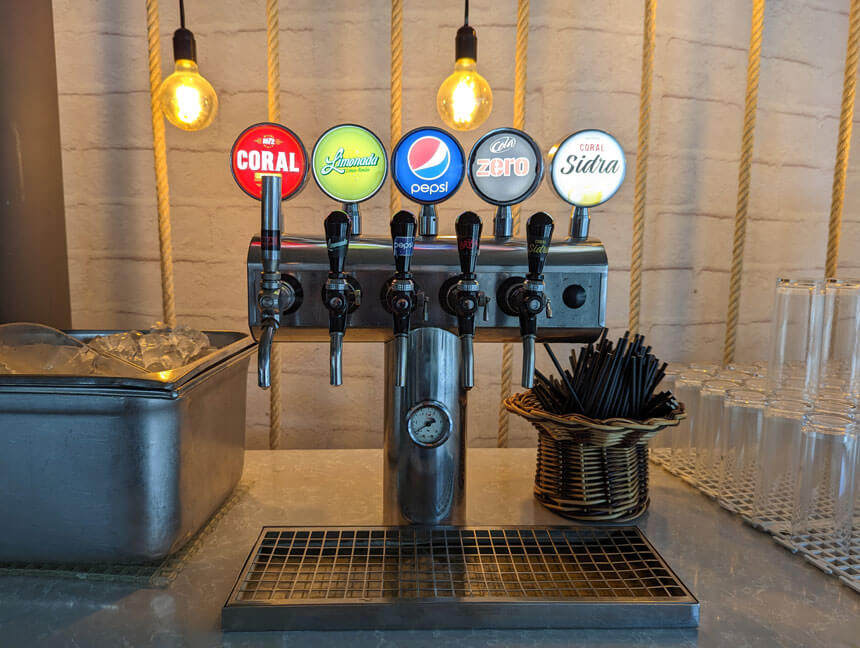 Soft drinks, beer and cider are available at all the bars. This is the self-service bar by the pool.