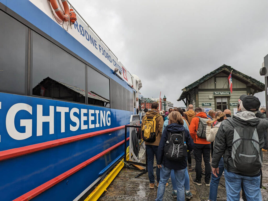 The queue to board the cruise boat in Bergen