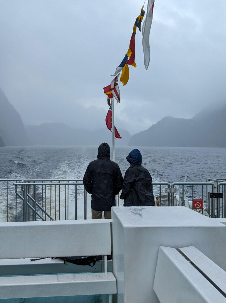 Two hardy souls on deck during our trip to Mostraumen