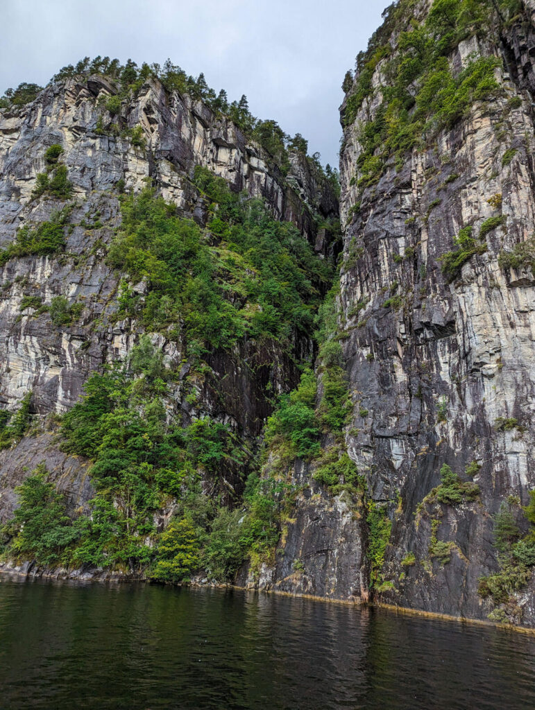 The steep cliffs at the side of the fjord