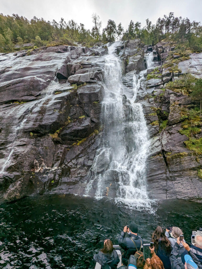 Getting up close with the Bergsåafossen waterfall on our Mostraumen fjord cruise