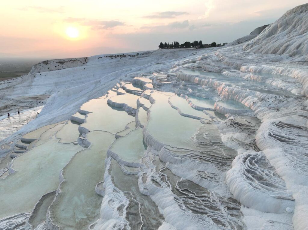 The ruins at Hierapolis are set above the travertine terraces at Pamukkale