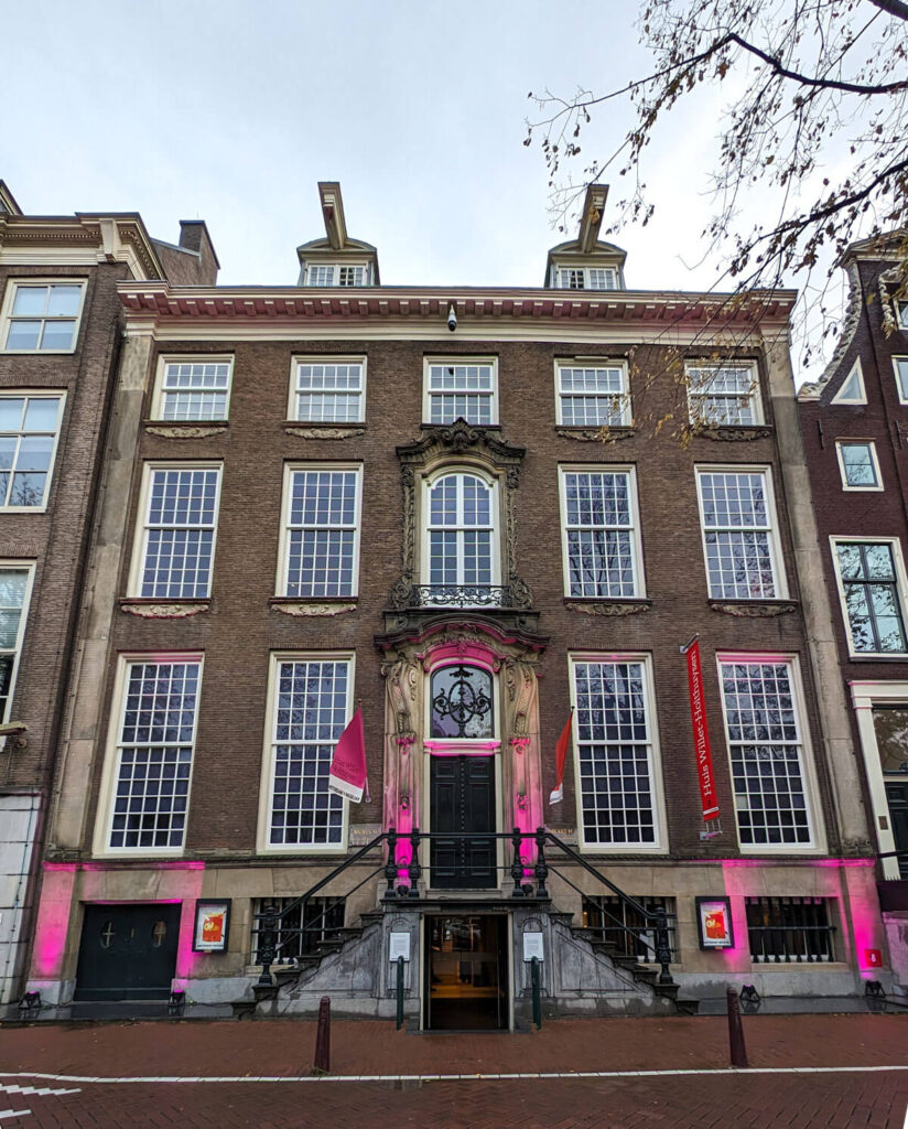 The grand Huis Willet-Holthuysen. A double fronted 18th century house with large windows and staircases leading up to a door in the centre.