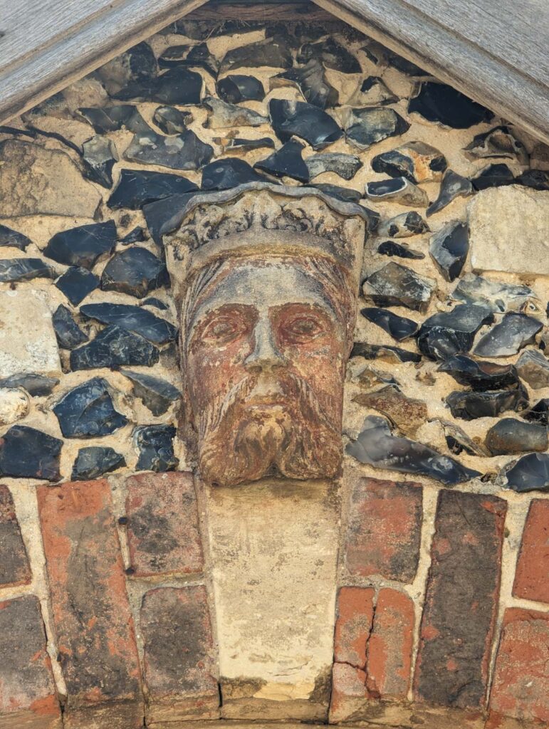 A carved head on the workhouse, repurposed from the old castle buildings