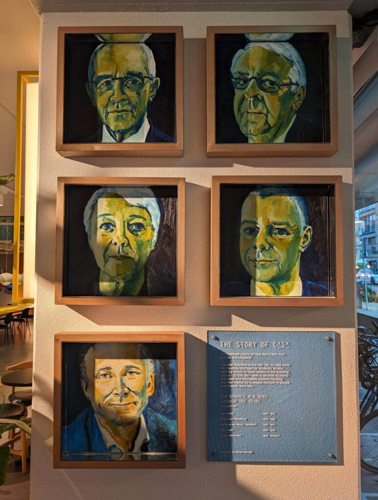 Portraits of Hotel Casa's founders hang in the lobby 