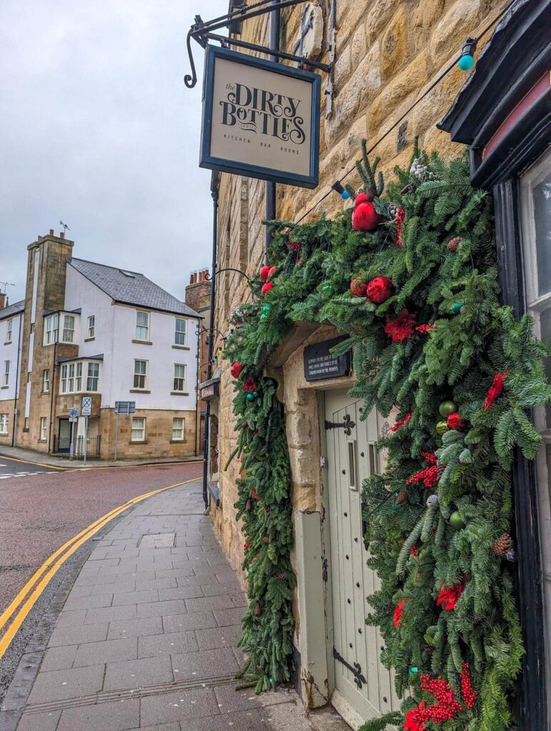 The entrance to the Dirty Bottles pub where you'll find Hallow and Crux 