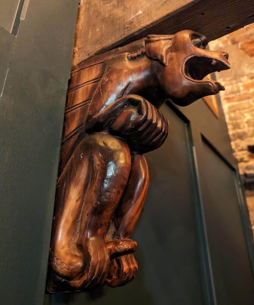 The carved wooden gargoyle in The Chamber