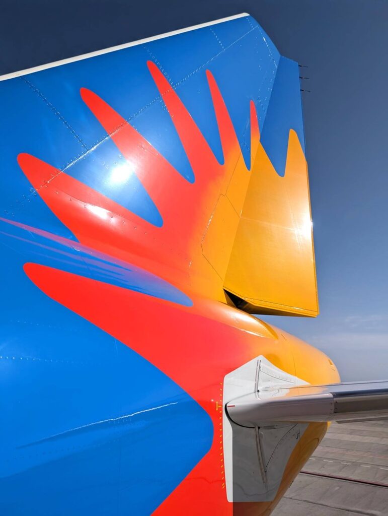 The tail of a Jet2 plane against blue skies at Tenerife South Airport.