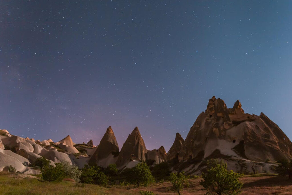 A beautiful night sky above the otherworldly landscapes of Cappadocia, Turkey